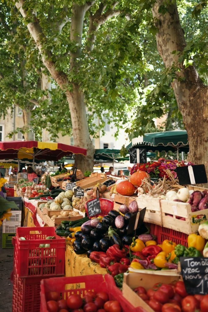 An outdoor vegetable market in Aix-en-Provence, France.